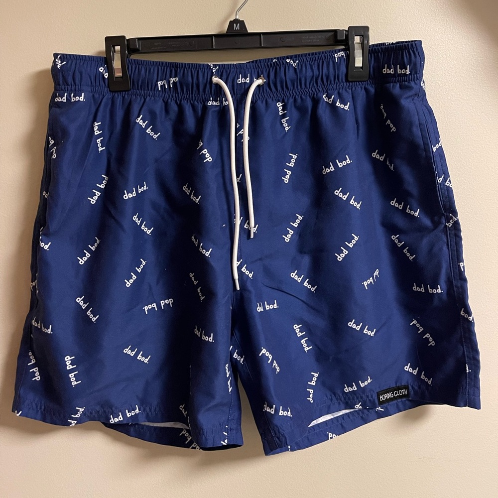 Boring Cloth “Dad Bod” swim trunks